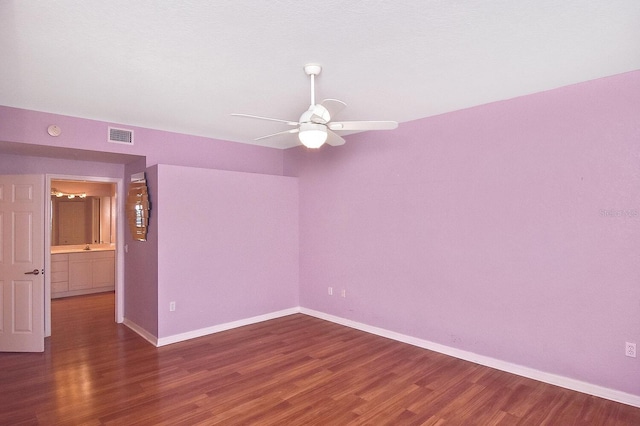 7605 Sweetbay Cir Unit 5-102, Bradenton, FL 34203 - empty room featuring a ceiling fan, wood finished floors, and a smoke detector