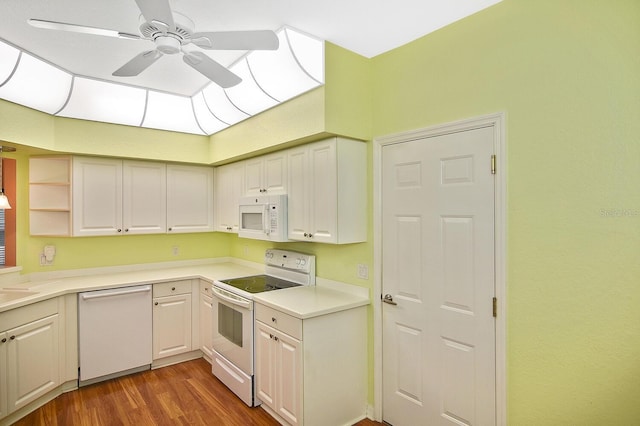 7605 Sweetbay Cir Unit 5-102, Bradenton, FL 34203 - kitchen featuring white appliances, a ceiling fan, wood finished floors, light countertops, and white cabinets