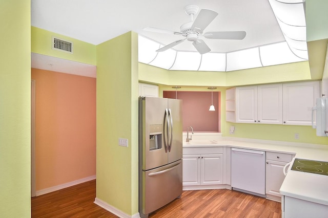 7605 Sweetbay Cir Unit 5-102, Bradenton, FL 34203 - kitchen with white appliances, light wood-style flooring, ceiling fan, and light countertops