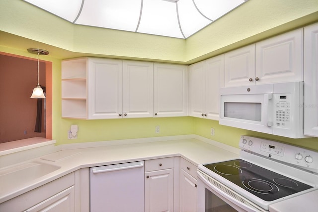 7605 Sweetbay Cir Unit 5-102, Bradenton, FL 34203 - kitchen featuring white appliances, white cabinets, pendant lighting, and light countertops
