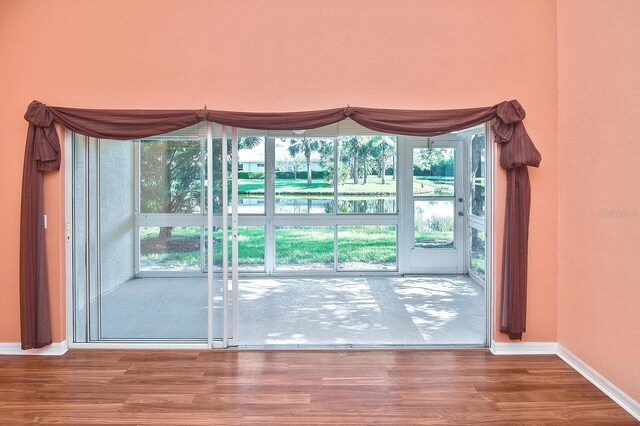 7605 Sweetbay Cir Unit 5-102, Bradenton, FL 34203 - spare room with wood finished floors and plenty of natural light
