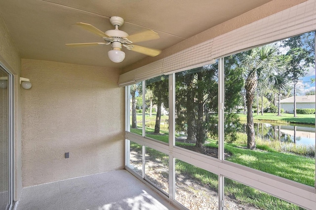7605 Sweetbay Cir Unit 5-102, Bradenton, FL 34203 - unfurnished sunroom featuring ceiling fan and a water view