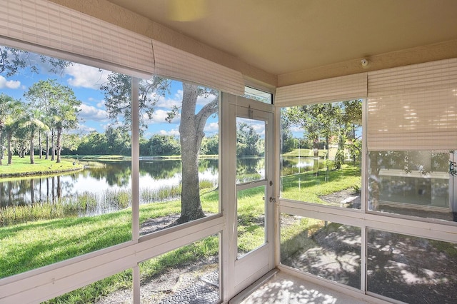 7605 Sweetbay Cir Unit 5-102, Bradenton, FL 34203 - unfurnished sunroom featuring a water view and view of wooded area