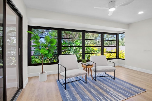 3518 Wilkinson Woods Dr Unit 11, Sarasota, FL 34231 - sunroom / solarium with baseboards and wood finished floors