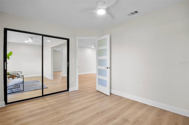 3518 Wilkinson Woods Dr Unit 11, Sarasota, FL 34231 - empty room featuring a ceiling fan and light wood-type flooring