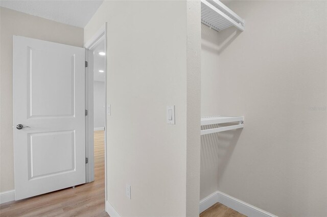 3518 Wilkinson Woods Dr Unit 11, Sarasota, FL 34231 - spacious closet featuring wood finished floors