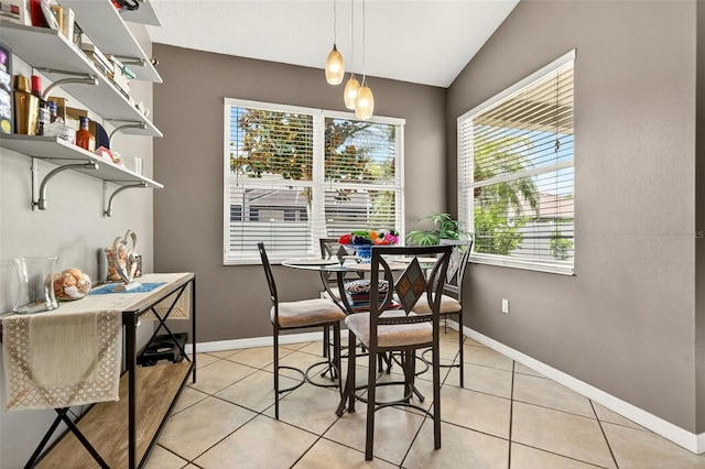 4668 73rd St E, Bradenton, FL 34203 - dining room with light tile patterned floors and lofted ceiling