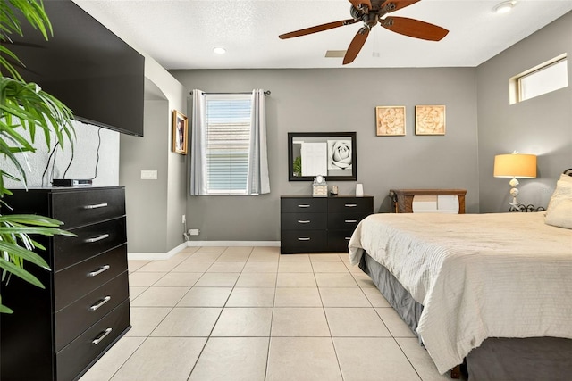 4668 73rd St E, Bradenton, FL 34203 - bedroom with light tile patterned floors and ceiling fan