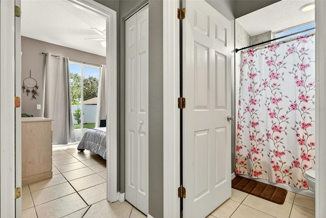4668 73rd St E, Bradenton, FL 34203 - bathroom featuring tile patterned floors, a shower with curtain, a ceiling fan, and vanity