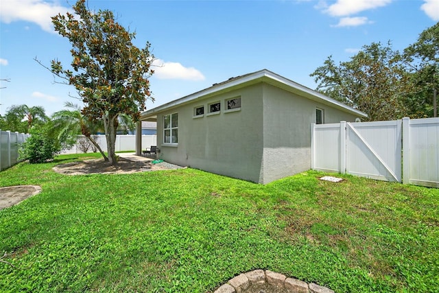 4668 73rd St E, Bradenton, FL 34203 - fenced backyard featuring a gate and a patio area