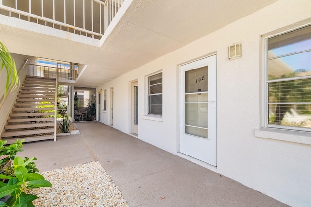 510 Granada Ave Unit 108, Venice, FL 34285 - property entrance with stucco siding and a patio
