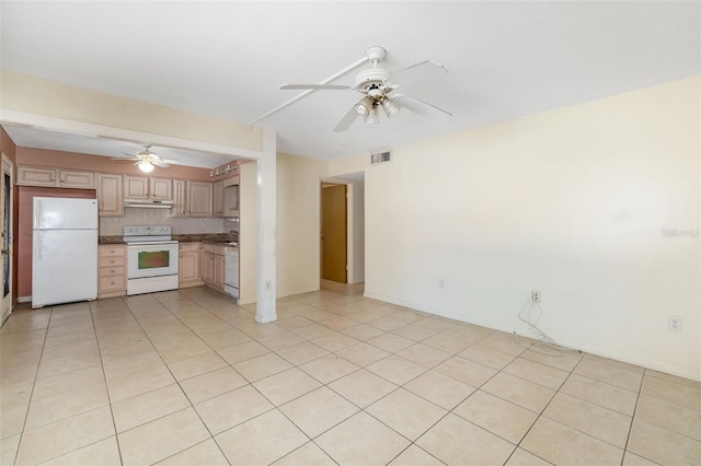 510 Granada Ave Unit 108, Venice, FL 34285 - kitchen with white appliances, ceiling fan, light tile patterned floors, and tasteful backsplash