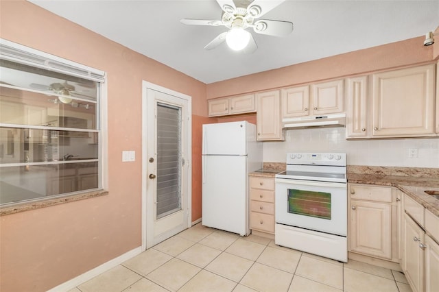 510 Granada Ave Unit 108, Venice, FL 34285 - kitchen featuring white appliances, under cabinet range hood, ceiling fan, light tile patterned flooring, and light stone counters