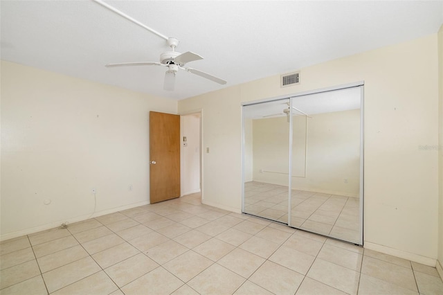 510 Granada Ave Unit 108, Venice, FL 34285 - unfurnished bedroom featuring light tile patterned floors, a closet, and ceiling fan