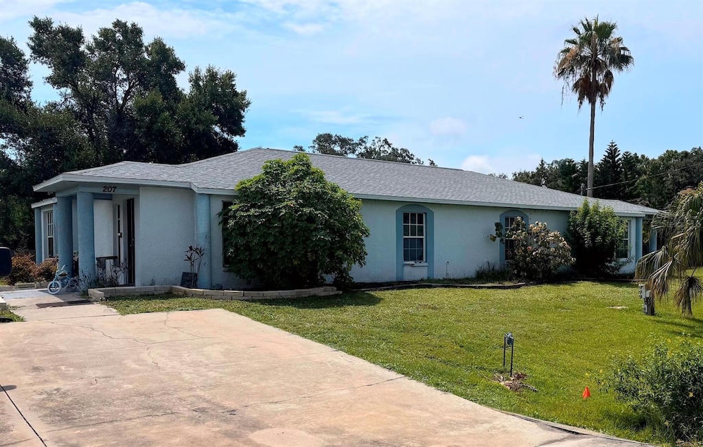 205 8th St NE Unit 205 207, Ruskin, FL 33570 - single story home featuring stucco siding and a front yard