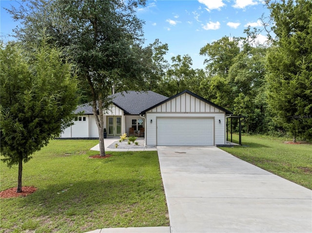174 SW Caboose Dr, Fort White, FL 32038 - view of front of house with french doors, board and batten siding, a garage, concrete driveway, and a front yard