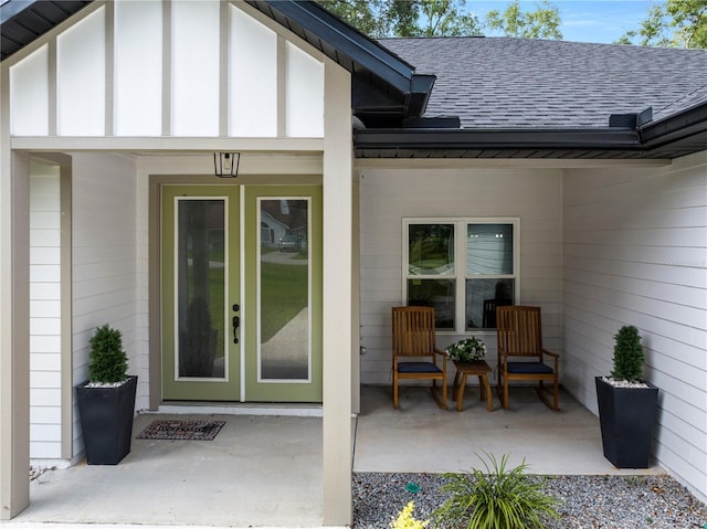 174 SW Caboose Dr, Fort White, FL 32038 - view of exterior entry featuring a shingled roof and french doors