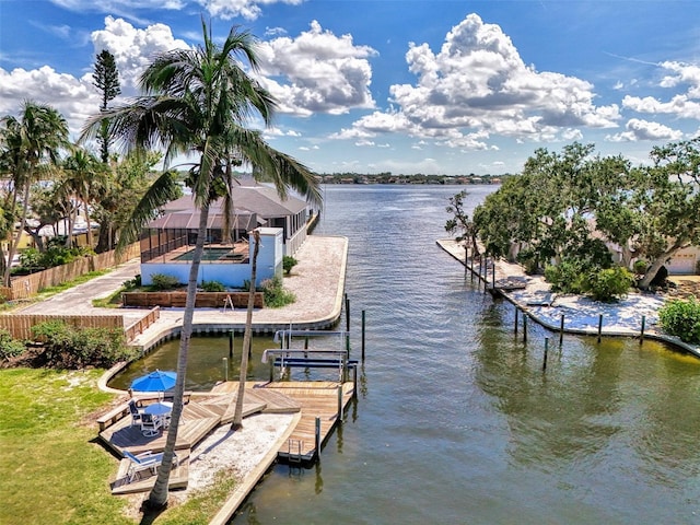 1236 Port Ln, Sarasota, FL 34242 - dock featuring a water view, boat lift, a lanai, and an outdoor pool
