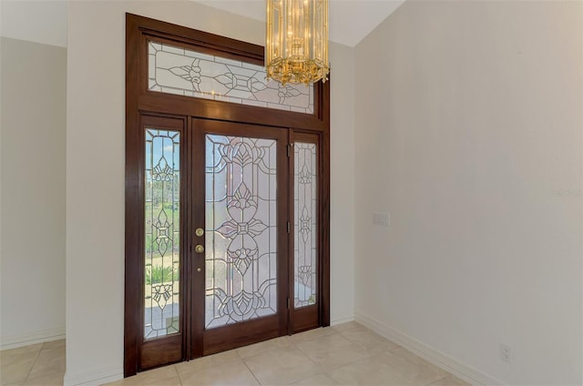 1236 Port Ln, Sarasota, FL 34242 - foyer entrance with a chandelier and light tile patterned flooring