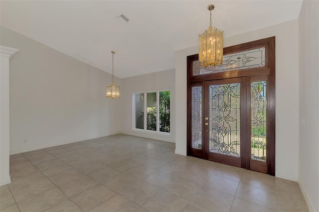1236 Port Ln, Sarasota, FL 34242 - entryway with a chandelier, light tile patterned flooring, and vaulted ceiling