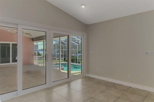 1236 Port Ln, Sarasota, FL 34242 - doorway featuring vaulted ceiling, ceiling fan, light tile patterned flooring, and a sunroom