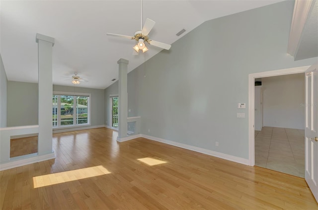 1236 Port Ln, Sarasota, FL 34242 - unfurnished living room with ceiling fan, light wood-style flooring, and high vaulted ceiling