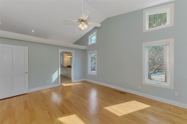 1236 Port Ln, Sarasota, FL 34242 - unfurnished bedroom with high vaulted ceiling, wood finished floors, ensuite bath, and ceiling fan