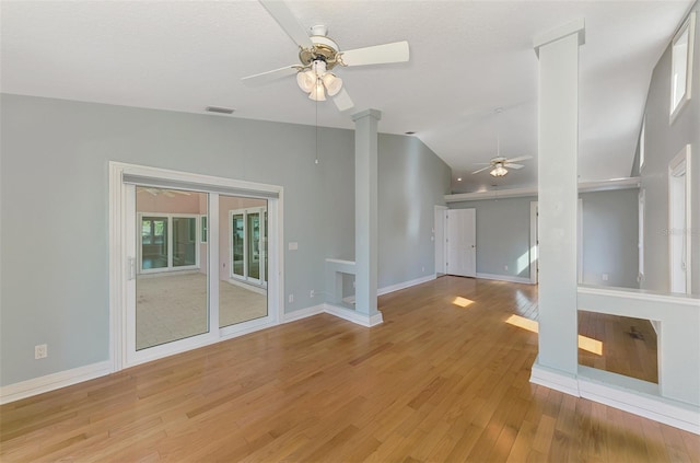 1236 Port Ln, Sarasota, FL 34242 - empty room with a ceiling fan, vaulted ceiling, decorative columns, and light wood-type flooring