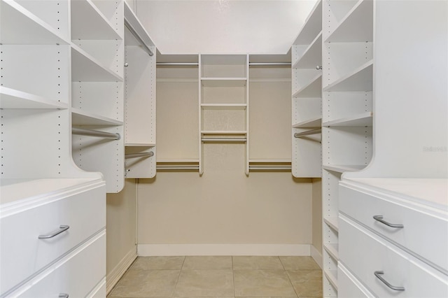 1236 Port Ln, Sarasota, FL 34242 - walk in closet with light tile patterned floors