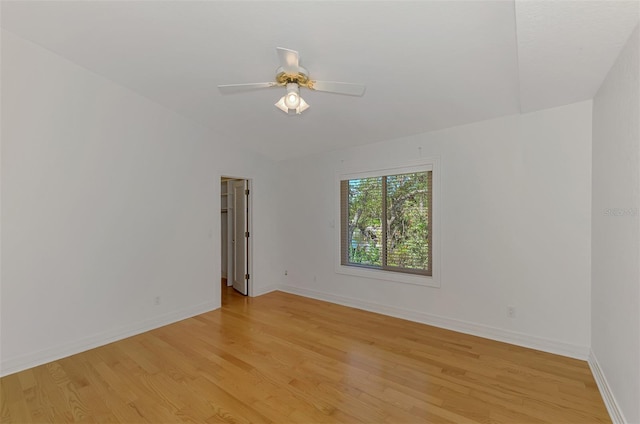 1236 Port Ln, Sarasota, FL 34242 - unfurnished room featuring light wood finished floors, vaulted ceiling, and a ceiling fan