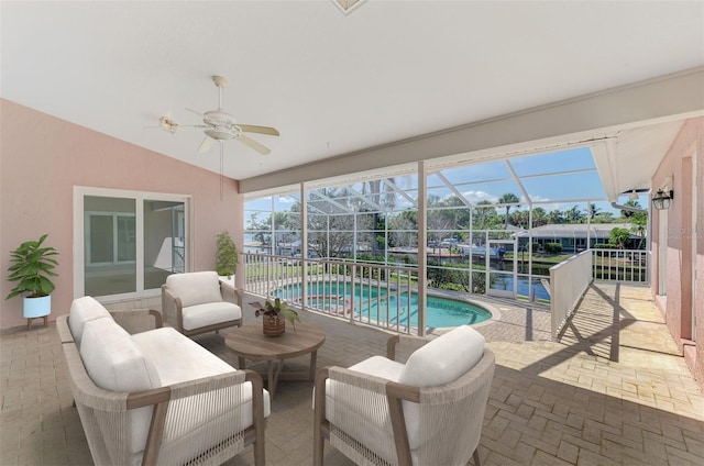 1236 Port Ln, Sarasota, FL 34242 - view of swimming pool featuring a patio, a ceiling fan, a pool with connected hot tub, an outdoor living space, and glass enclosure