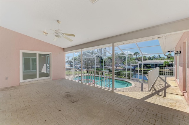1236 Port Ln, Sarasota, FL 34242 - view of pool featuring a patio area, ceiling fan, a pool with connected hot tub, and glass enclosure