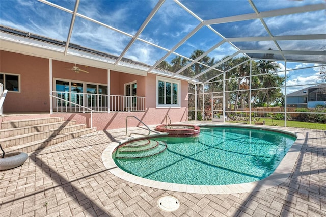 1236 Port Ln, Sarasota, FL 34242 - view of pool featuring a patio, a pool with connected hot tub, a ceiling fan, and glass enclosure