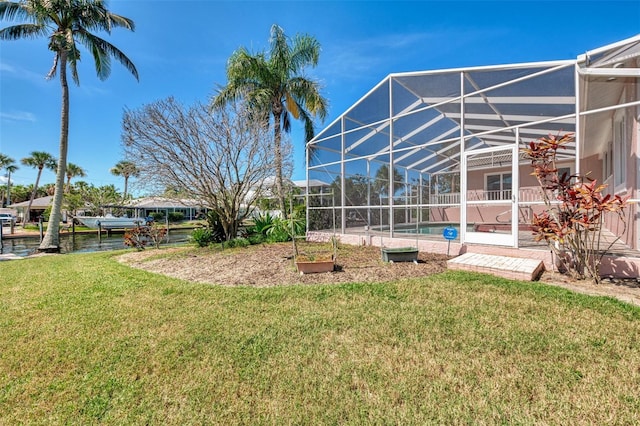 1236 Port Ln, Sarasota, FL 34242 - view of grassy yard with glass enclosure and an outdoor pool