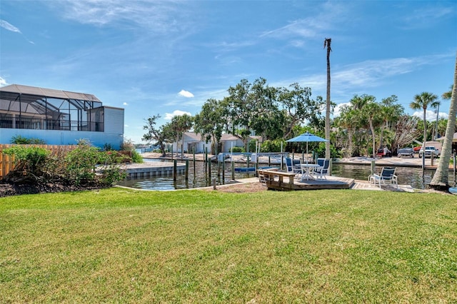 1236 Port Ln, Sarasota, FL 34242 - view of grassy yard with a deck with water view