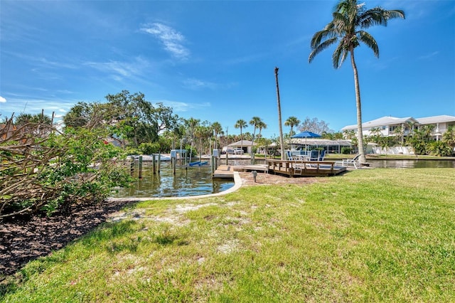 1236 Port Ln, Sarasota, FL 34242 - dock area with a yard and a water view