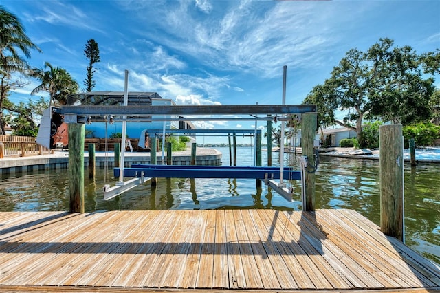 1236 Port Ln, Sarasota, FL 34242 - dock featuring boat lift and a water view