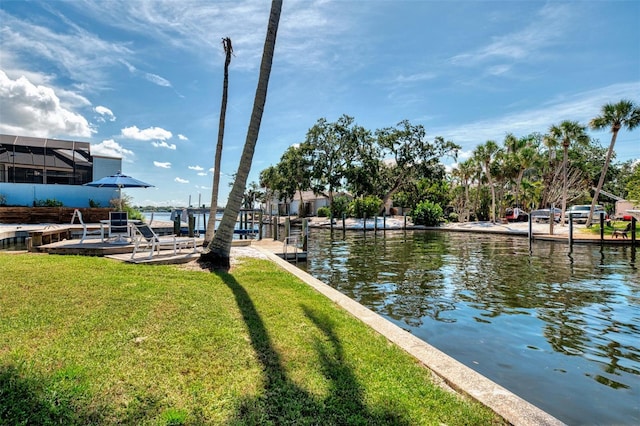 1236 Port Ln, Sarasota, FL 34242 - dock area featuring a water view and a lawn