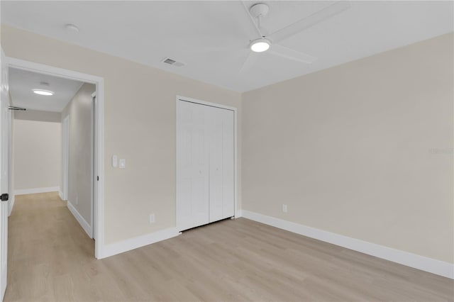 1820 Putney Cir, Orlando, FL 32837 - unfurnished bedroom featuring light wood finished floors, a closet, and a ceiling fan
