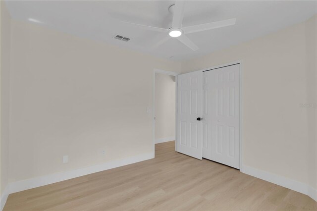 1820 Putney Cir, Orlando, FL 32837 - unfurnished bedroom with light wood finished floors, a closet, and ceiling fan