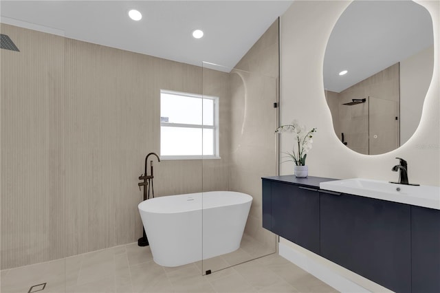 1820 Putney Cir, Orlando, FL 32837 - bathroom featuring a freestanding tub, vanity, a walk in shower, and tile patterned floors