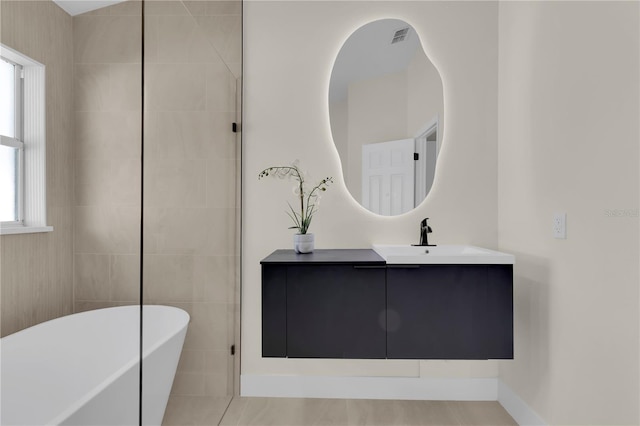 1820 Putney Cir, Orlando, FL 32837 - full bath with a freestanding tub and vanity