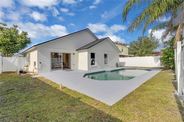 1820 Putney Cir, Orlando, FL 32837 - back of property with stucco siding, a fenced backyard, and a patio