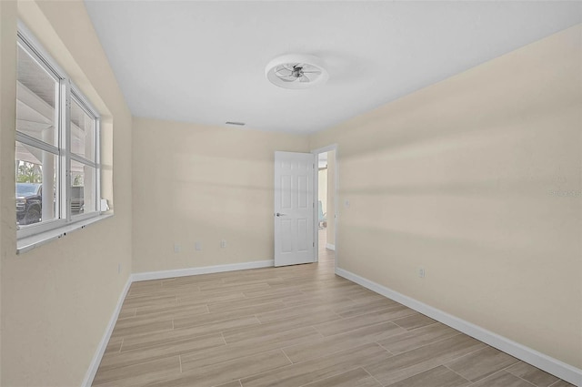 5830 Midnight Pass Rd Unit 108, Sarasota, FL 34242 - spare room featuring light wood-style flooring and ceiling fan