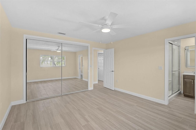 5830 Midnight Pass Rd Unit 108, Sarasota, FL 34242 - unfurnished bedroom with light wood-style floors, a closet, and ceiling fan