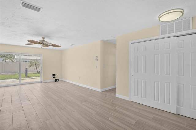 5830 Midnight Pass Rd Unit 108, Sarasota, FL 34242 - unfurnished living room with ceiling fan and light wood finished floors