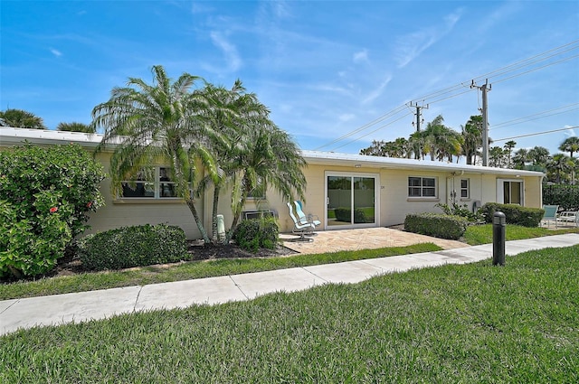 5830 Midnight Pass Rd Unit 108, Sarasota, FL 34242 - view of front of home featuring a front lawn and a patio