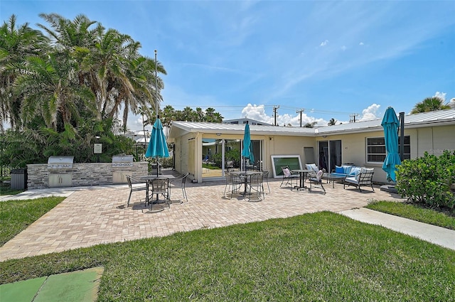 5830 Midnight Pass Rd Unit 108, Sarasota, FL 34242 - view of patio / terrace featuring an outdoor kitchen and outdoor lounge area