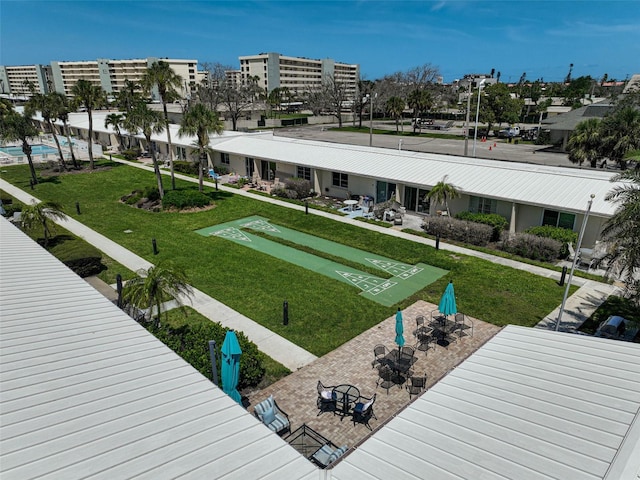 5830 Midnight Pass Rd Unit 108, Sarasota, FL 34242 - view of community featuring shuffleboard and a yard