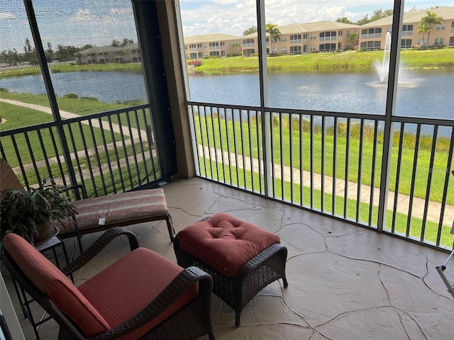 6444 7th Avenue Cir W Unit 6444, Bradenton, FL 34209 - sunroom / solarium featuring plenty of natural light and a water view